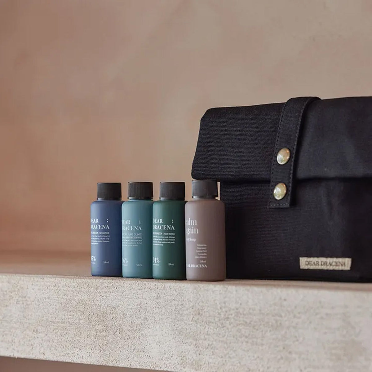 DEAR; DRACENA DEAR; DRACENA Therapy Black Travel Set - soothing - front bottle shot